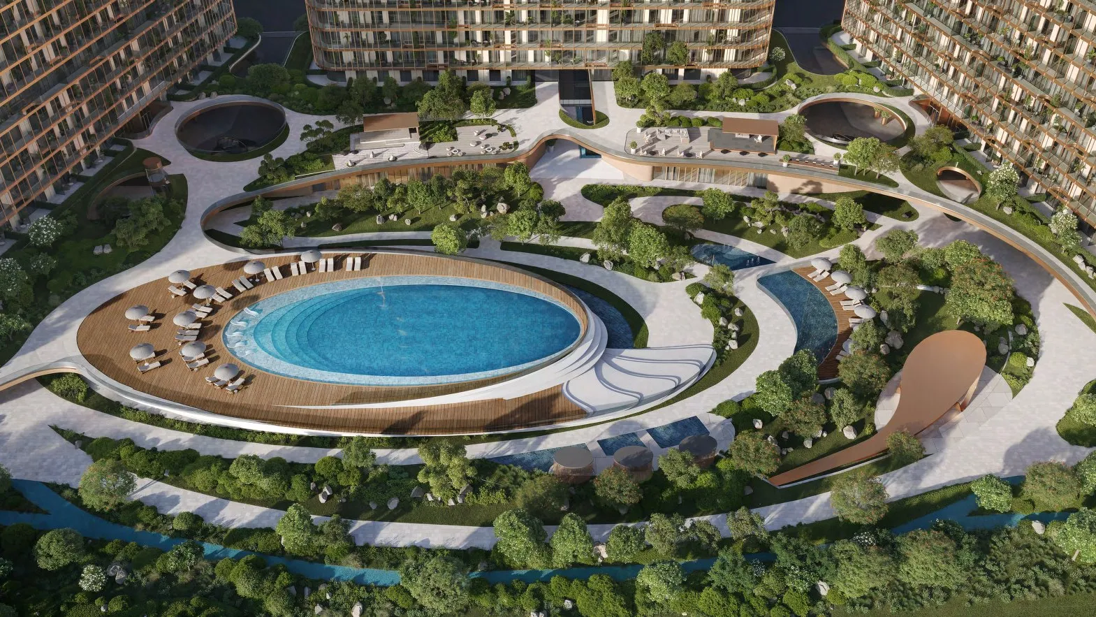 Aerial view of HADO's oval pool and gardens between three towers