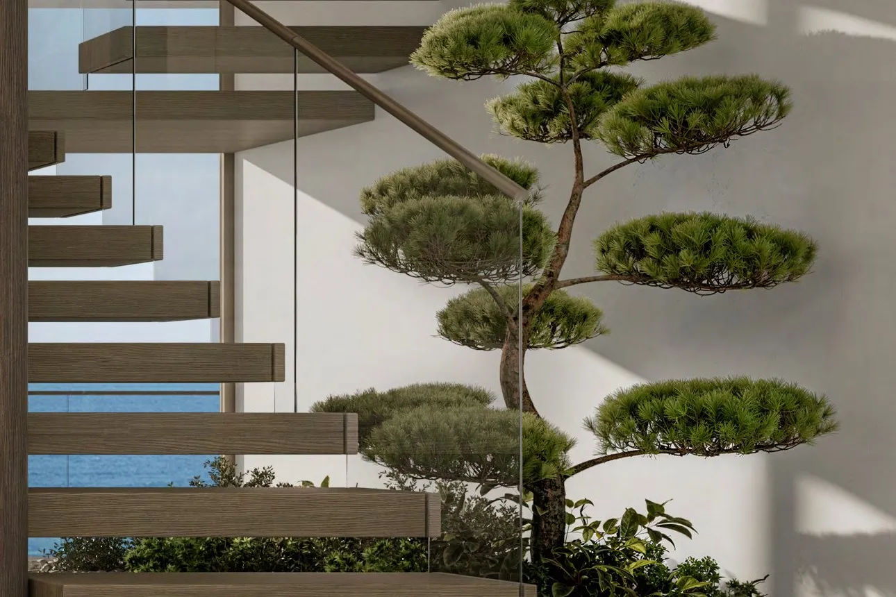 Floating oak staircase beside an indoor bonsai garden