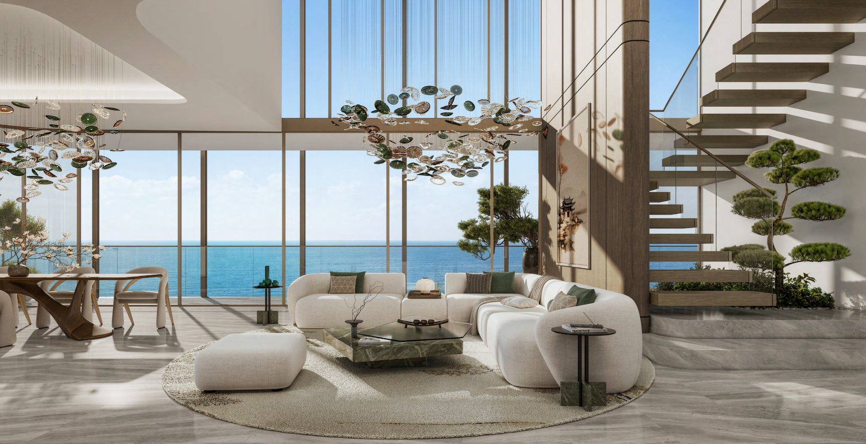 Double-height living room facing the sea with a floating timber staircase