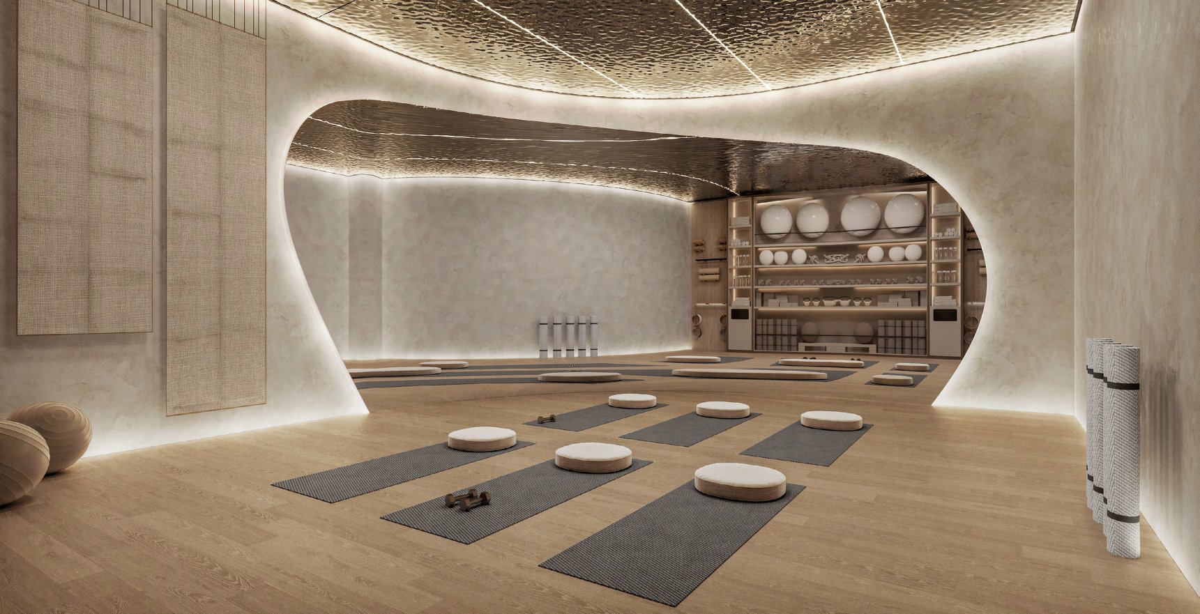 Yoga studio with oak floor, mats and softly lit curved walls